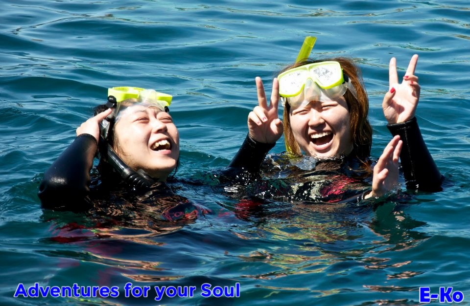 Happy asian girls swimming